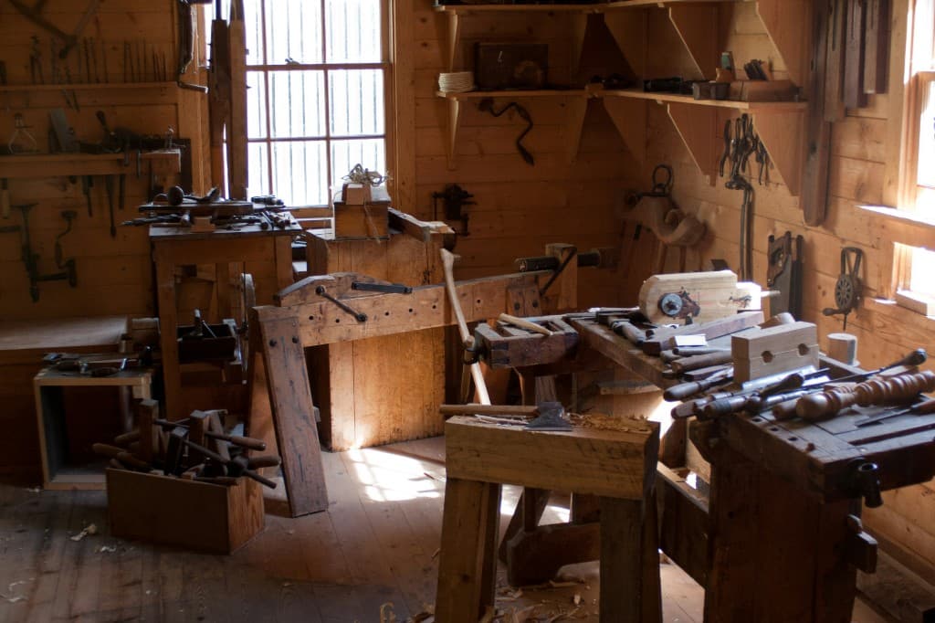Traditional woodworking workshop with hand tools and workbenches